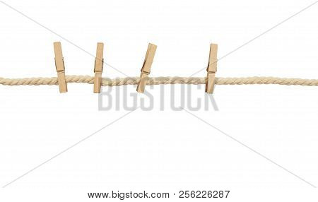 Beige Cotton Stretched Rope And Four Pins Isolated On White Background