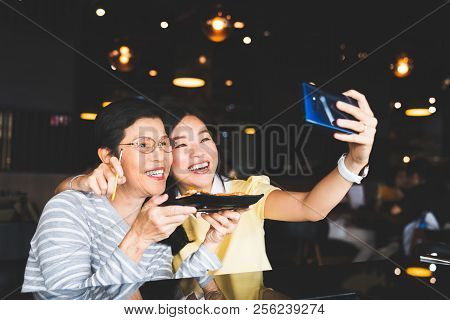 Bangkok, Thailand - Aug 28, 2018: Asian Mother And Daughter Taking Selfie Photo Together With Food A