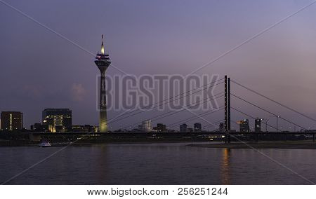 View Of The Rhine Tower At Night In Dusseldorf, Germany.