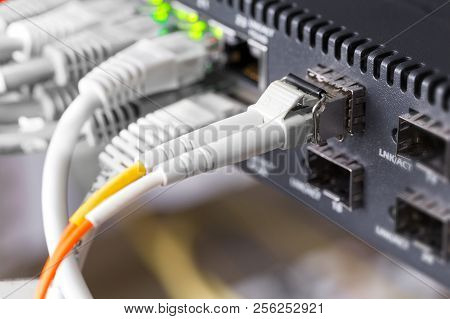 Close-up Of High Speed Fiber Network Switch And Cables In Datacenter