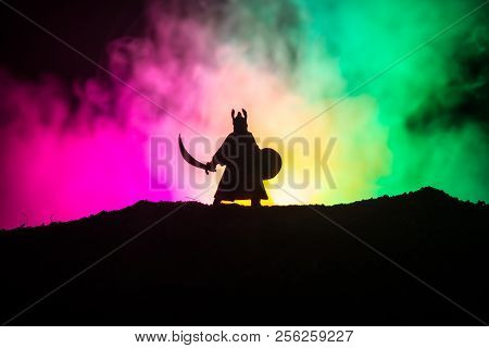 Fighter With A Sword Silhouette A Sky. Medieval Knight With Sword. Selective Focus