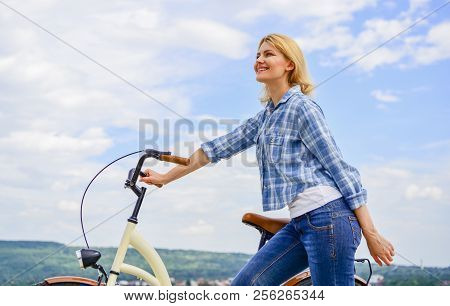 Woman Rides Bicycle Sky Background. How To Learn To Ride Bike As An Adult. Active Leisure. Healthies