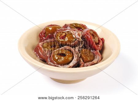 Anchovy Fillets Stuffed With Olives And Pepper Isolated Over White Background