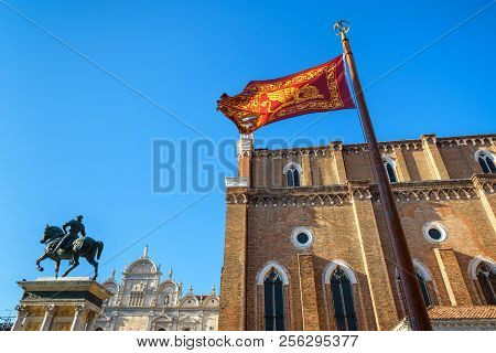 Flag Of Venice Near The Basilica Di San Giovanni E Paolo In Venice, Italy. This Old Church Is One Of