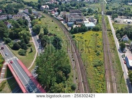 Aerial view on of railroad and car road in city