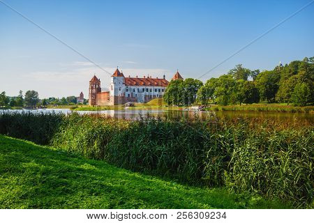 Mir, Belarus - August 11, 2017: Castle On The Shore Of The Lake. Castle In Mir, Belarus - Historical