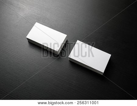 Blank Business Cards On Black Wood Background. Mockup For Branding Identity.