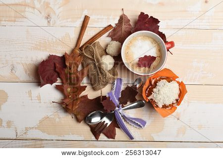 Red Ceramic Tableware With Beverage And Desserts, Top View. Cup Of Cappuccino Coffee On Wooden Backg