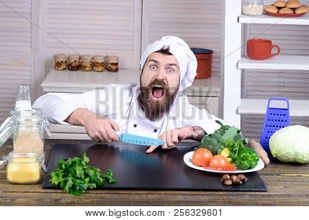 Chef Man. Kitchen Accessories, Cooking Equipment. Male Chef Cutting His Finger. Bearded Man Cut In H