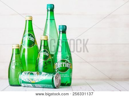 London, Uk - September 03, 2018: Bottles And Aluminium Tin Of Perrier Sparkling Water On Wooden Back