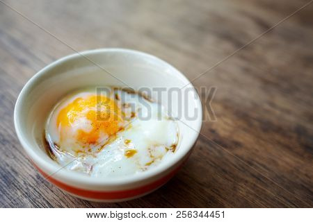 Onsen Tamago Egg Or Soft-boiled Egg In Traditional Japanese Served With Paper And Shoyu Soy Sauce, C