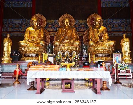 Nonthaburi, Thailand - August 26, 2018: Three Golden Buddha Statues For Pray At Chinese Temple Name 