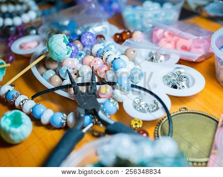 Accessories Creating. Working Disorder On The Table. Buds Of Polymer Clay, Round Pliers, Working Spa