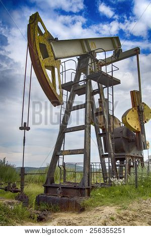 Oil Pump Is On A Background Mountains