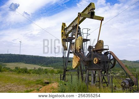 Oil Pump Is On A Background Mountains