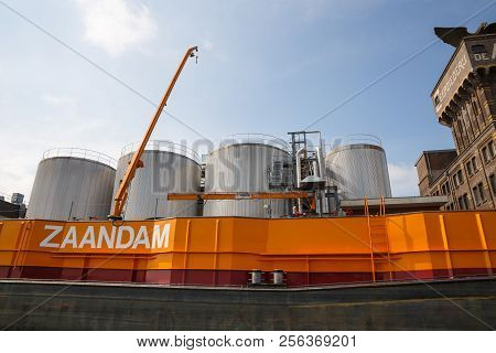 Zaanse Schans, Netherlands, August 19, 2015 - Industrial Area With Containers, Boat And Crane.