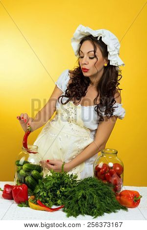 A Professional Pregnant Chef In The Kitchen Prepares The Dough With Flour To Make The Baking.
