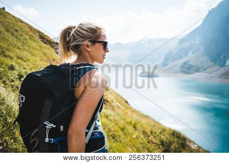 Adventurous Sportive Girl Hiking At A Lake In Beautiful Alpine Mountains