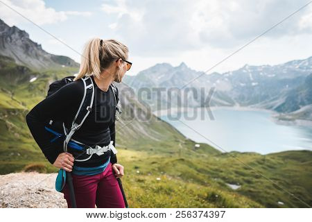 Adventurous Sportive Girl Hiking At A Lake In Beautiful Alpine Mountains