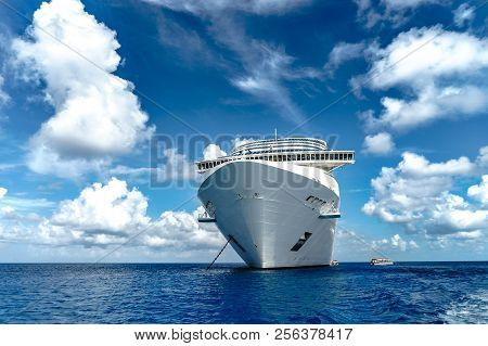 Cruise Ship In Crystal Blue Water With Blue Sky