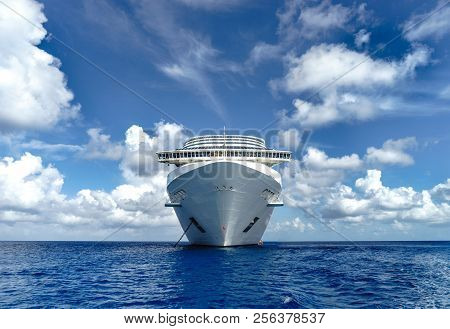 Cruise Ship In Crystal Blue Water With Blue Sky