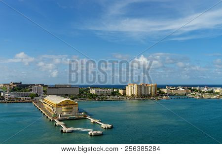 Scenic View Of Historic Colorful Puerto Rico City In Distance From The Sea With The Port In Foregrou