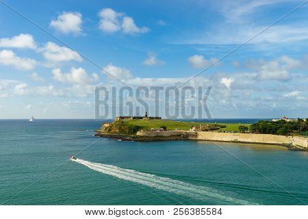 Scenic View Of Historic Colorful Puerto Rico City In Distance With Fort In Foreground