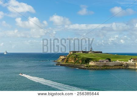 Scenic View Of Historic Colorful Puerto Rico City In Distance With Fort In Foreground
