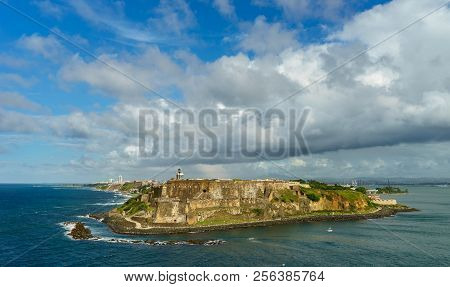 Scenic View Of Historic Colorful Puerto Rico City In Distance With Fort In Foreground