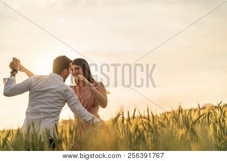 Romantic Couple on a Love Moment at gold wheat flied - Holambra, Sao Paulo, Brazil