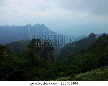 Photographed In Huangshan Scenic Area, China, With Mountains And Trees