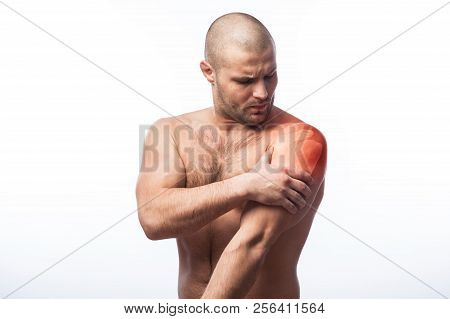 Injury To Forearm, Shoulder Pain Young Balding Athletic Man Holding A Sore Arm On A White Isolated B