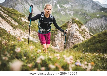 Adventurous Sportive Girl Hiking In Beautiful Alpine Mountains