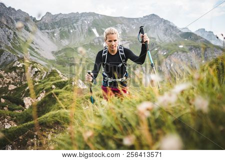 Adventurous Sportive Girl Hiking In Beautiful Alpine Mountains