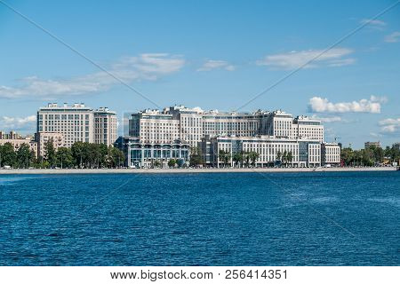 On The Banks Of The Bolshoy Nevka River On Ushakovskaya Embankment Are Modern High-rise Buildings In