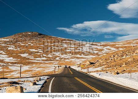 Trail Ridge Road, the highest (12,183 feet) continuous highway in the USA in high alpine tundra with rocks and mountains at autumn. Rocky Mountain National Park in Colorado, USA. 