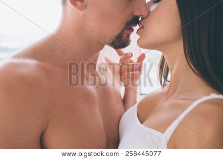 Close Up And Cut View Of Man And Woan Almost Kissing Each Other. She Touches His Chin With Fingers. 