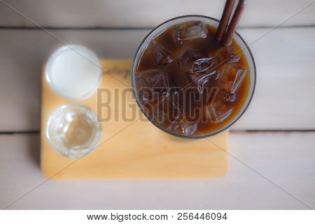 Ice Long Black Coffee In A Glass Served With Maik And Water