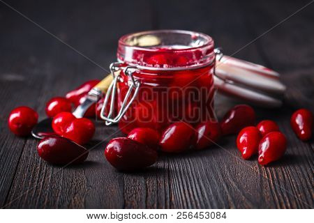 Ripe Red Cornel Berries Small Glass Jar Old Wooden Background Autumn Harvest Wild Berries