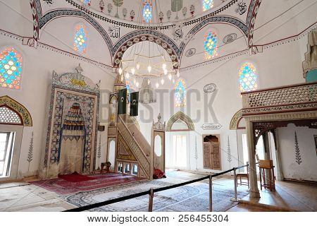MOSTAR, BOSNIA AND HERZEGOVINA - JULY 11, 2018: interior of Koski Mehmed Pasha Mosque with mihrab and qubba