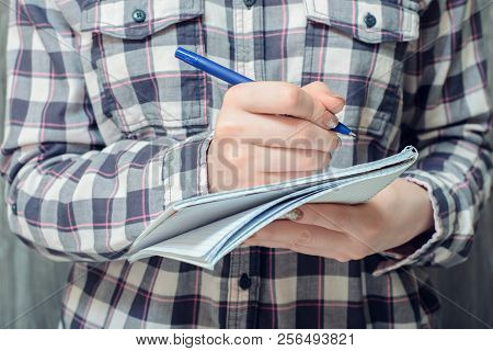 Student's Hand Writing In Copybook, Close-up Photo