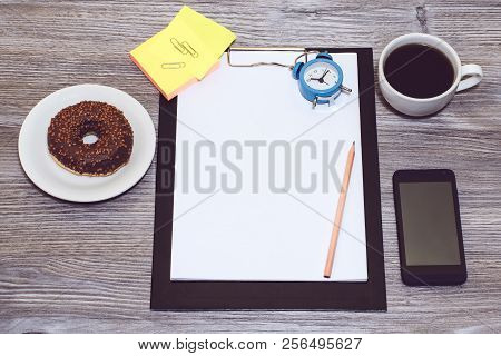 Overhead View Of Student's, Worker's Workplace. Office Accessorise, Phone, Clipboard, Notepad, Alarm