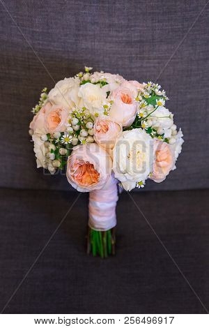 Beautiful Round Bouquet Of Wedding Pions On A Leg