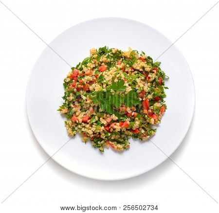 Tabbouleh Salad With Burghul Or Bulgur. On White Plate