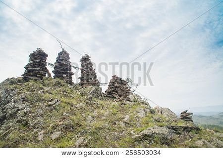 Rock Pillars On Top Of The Hillock Dedicated To A Local Tutelary Deity
