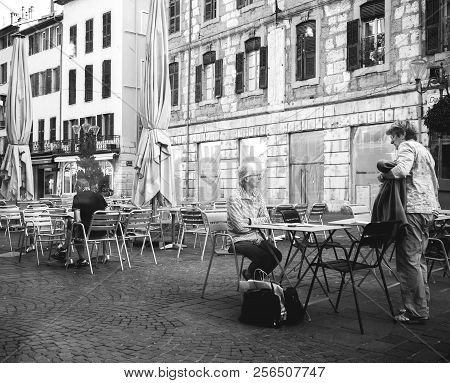 Chambery, France - Aug 16, 2018: Senior Women At The Outdoor Cafe In Central Chambery Early In The M