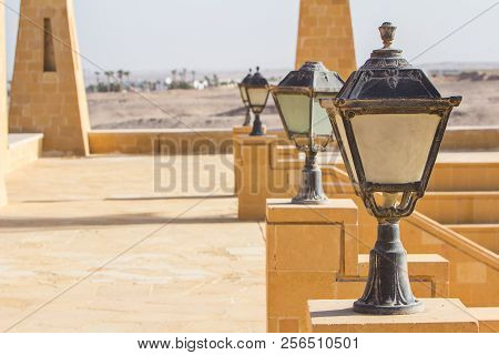 Lantern In An Ancient Egyptian Style Against The Backdrop Of Ancient Buildings And Deserts