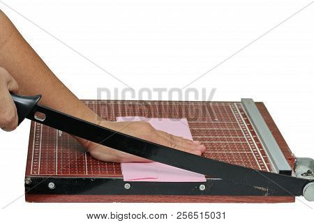 Hands Take To Cut The Pink Envelope  By Using Wooden Guillotine Paper Trimmer And Cutter