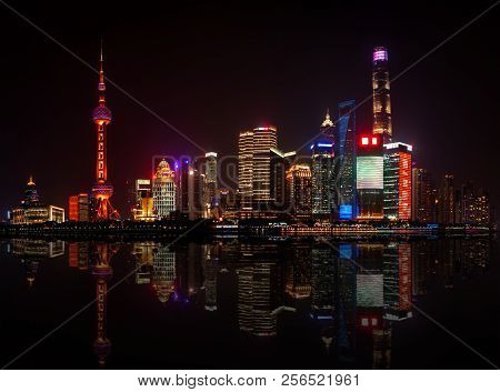 Panoramic Night View Of The New Modern District Of Shanghai Pudong From The Embankment Of The Waitan