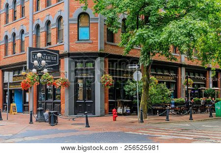 August 03, 2018 - Vancouver, Canada:  Popular Cambie Street With Restaurants And Hanging Flower Bask